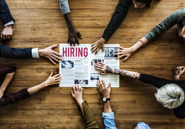 Hands Reach Out for Newspaper — Stock Photo, Image