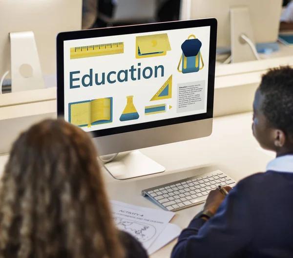 Boy and girl looking at monitor screen — Stock Photo, Image