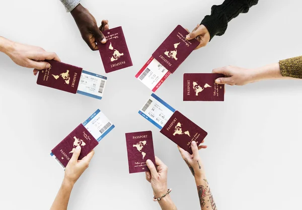 Hands holding passports — Stock Photo, Image