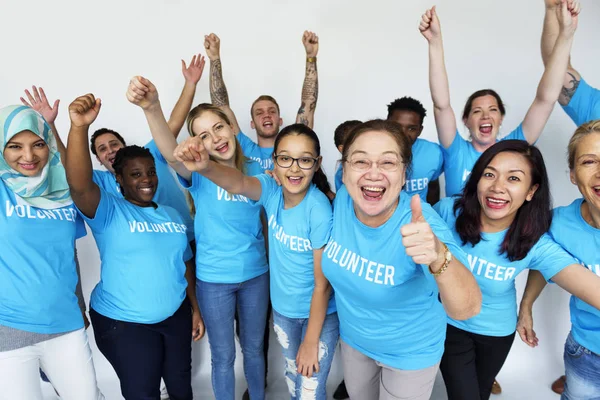 Volunteer people with rised up hands — Stock Photo, Image