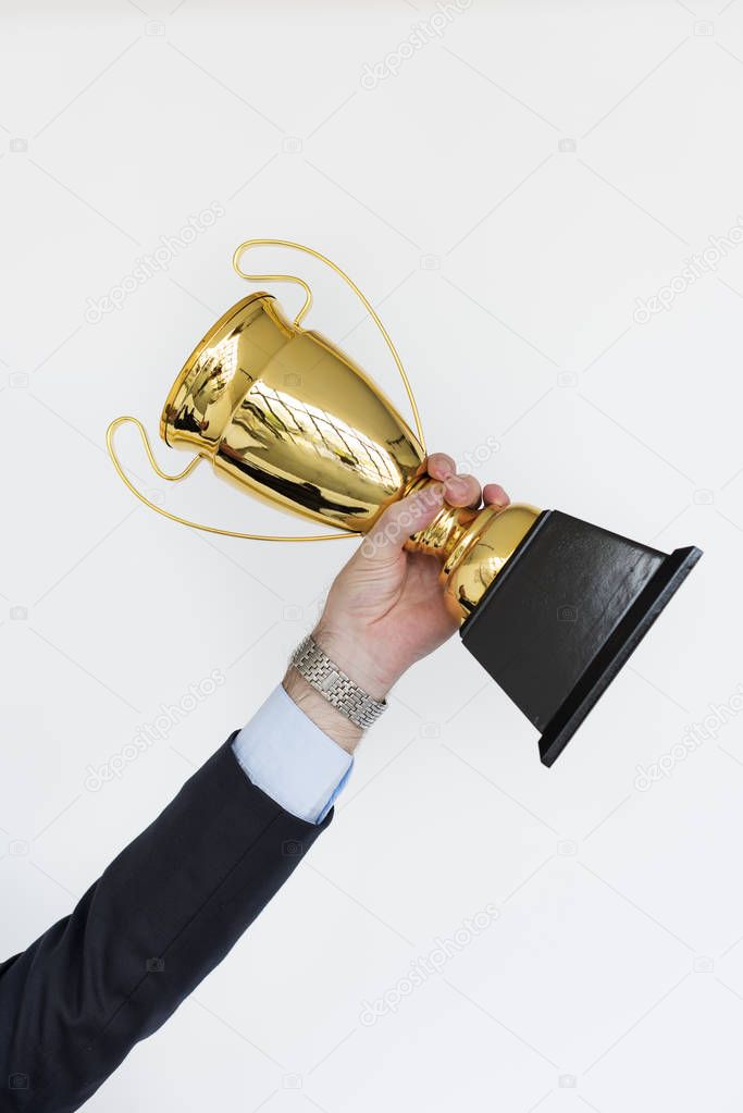 Human Hand Holding Trophy
