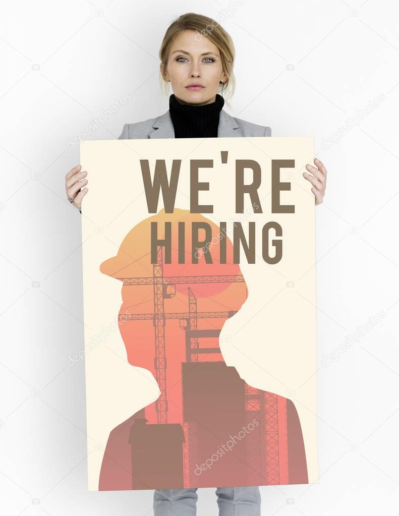 Business woman holds placard 