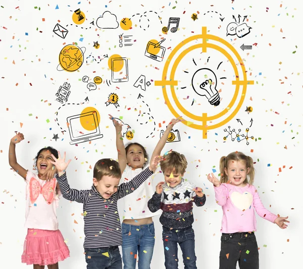 Happy children throwing confetti — Stock Photo, Image