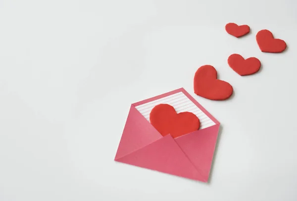 Hearts and letter on white background — Stock Photo, Image
