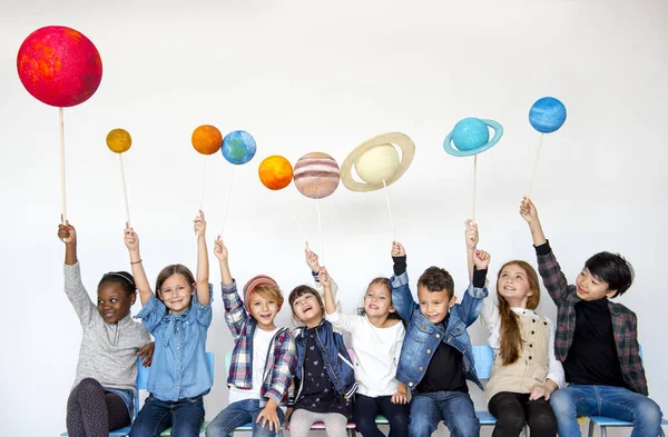 Children holding solar system — Stock Photo, Image