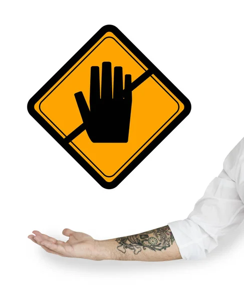 警告サインで指している男性の手 — ストック写真