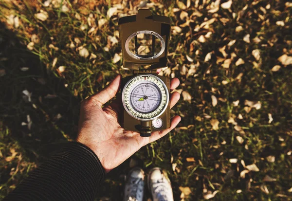 Woman holding compass — Stock Photo, Image