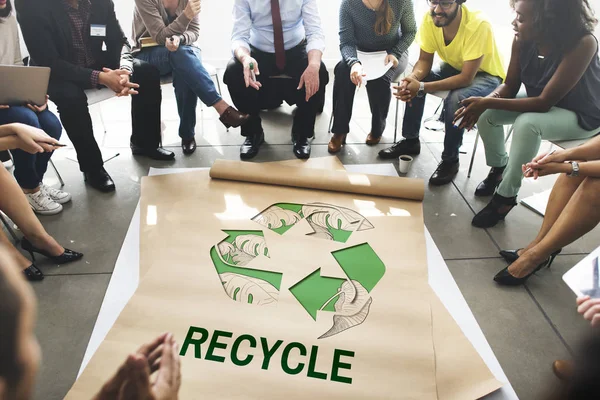 People sitting in circle over poster — Stock Photo, Image