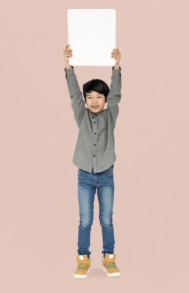 Boy holding blank board — Stock Photo, Image