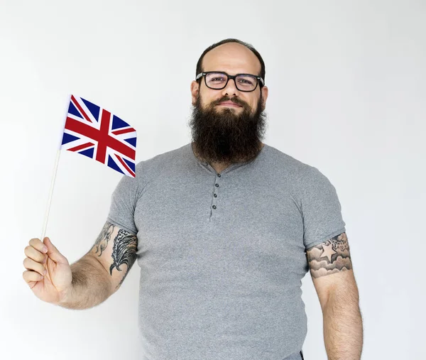 Man innehav brittiska flaggan — Stockfoto