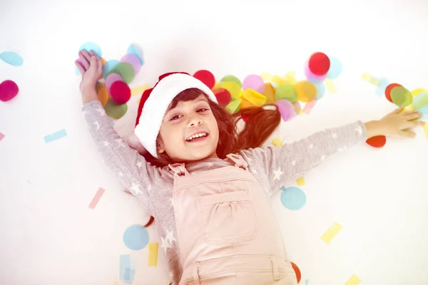 Niña en sombrero de Santa Claus —  Fotos de Stock