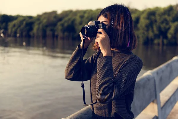 Woman Taking picture on photo camera — Stock Photo, Image