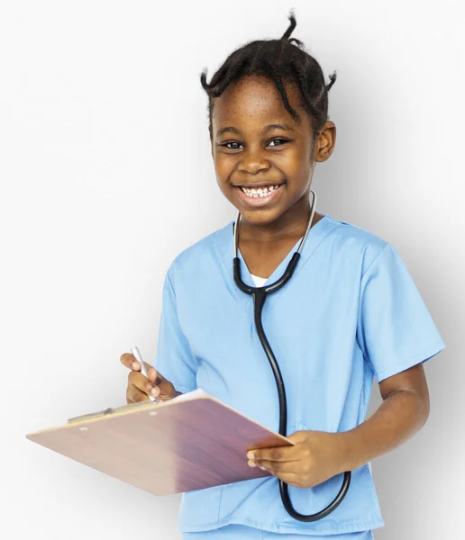 Meisje in uniform van de arts — Stockfoto