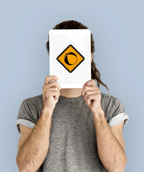 Man holding digital tablet covering face — Stock Photo, Image