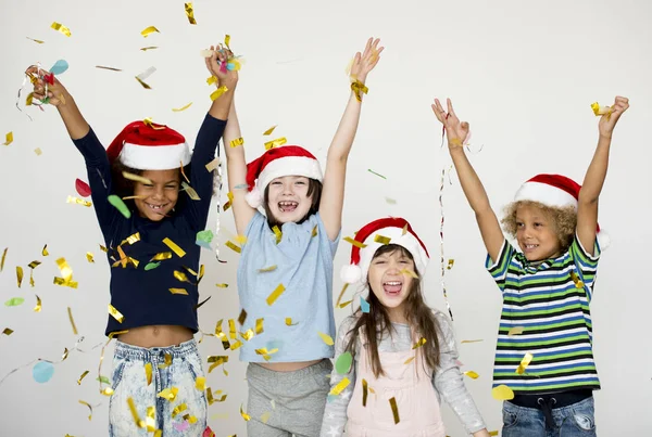 Kids in santa claus hats — Stock Photo, Image