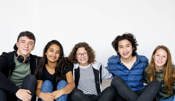 Students sitting on the floor in the studio