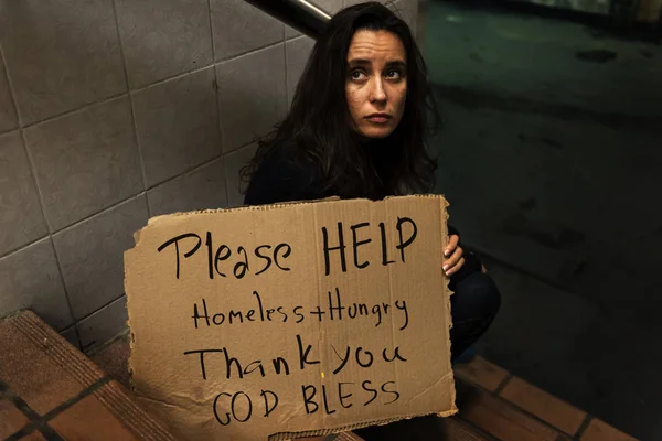 Homeless woman asking for money donation