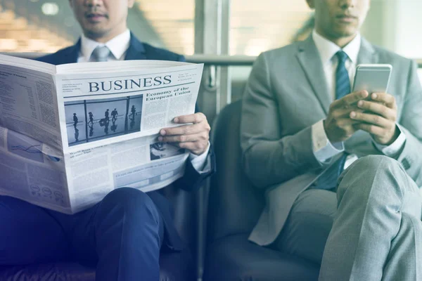 Business Men Reading  Newspaper