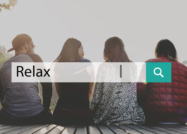 Young people sitting on wooden planks — Stock Photo, Image