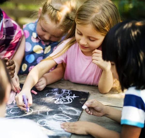 Kids Drawing on Chalkboard — Stock Photo, Image