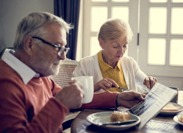 Senior couple having breakfast — Stock Photo, Image