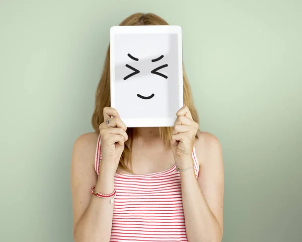 Woman holding digital tablet covering face — Stock Photo, Image