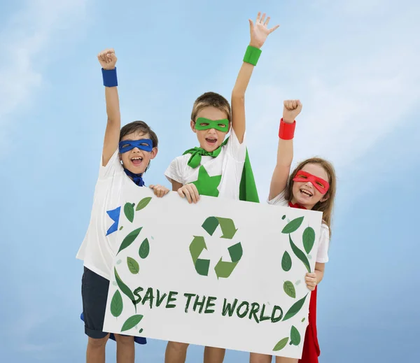 Superheroes kids holding poster — Stock Photo, Image