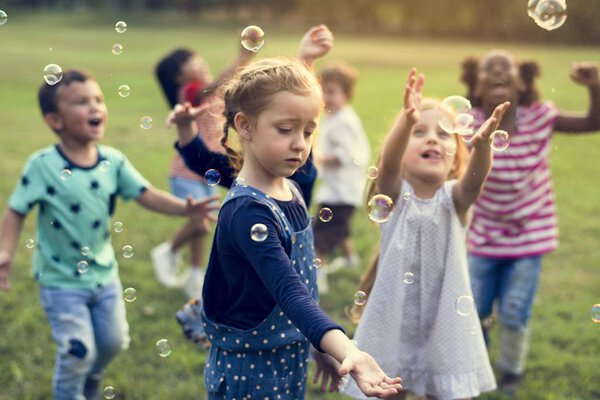 kids blowing bubbles