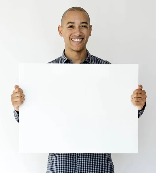 Mixed race man holding placard — Stock Photo, Image