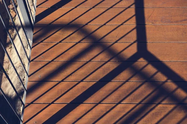 Schatten von Zaun und Holzbohlen — Stockfoto