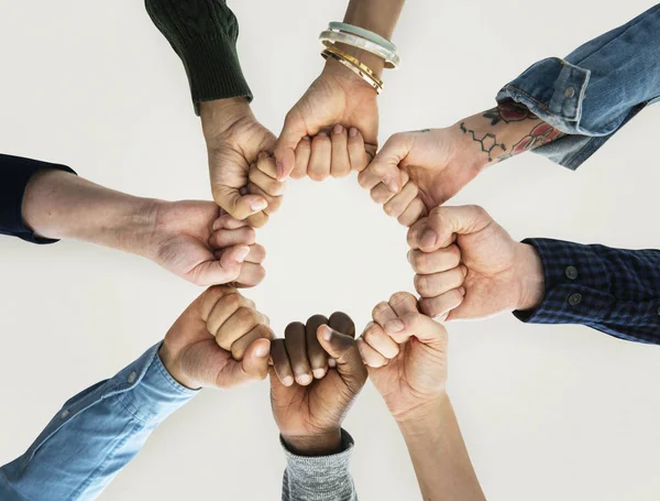 Manos humanas puños juntos en círculo — Foto de Stock