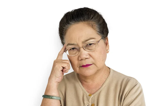 Serious  Senior Asian Woman in the studio — Stock Photo, Image