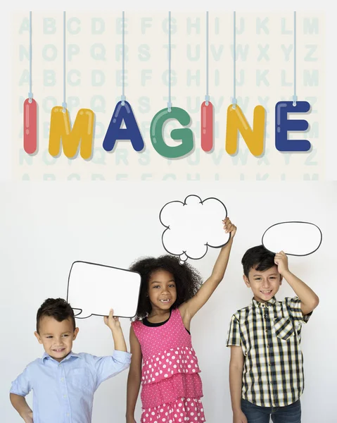 Children holding speech bubbles — Stock Photo, Image