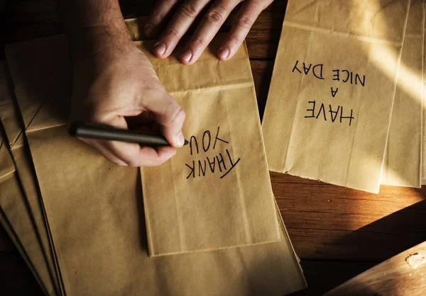 Person Hands Writing Thankful Words Paper Bag Original Photoset — Stock Photo, Image