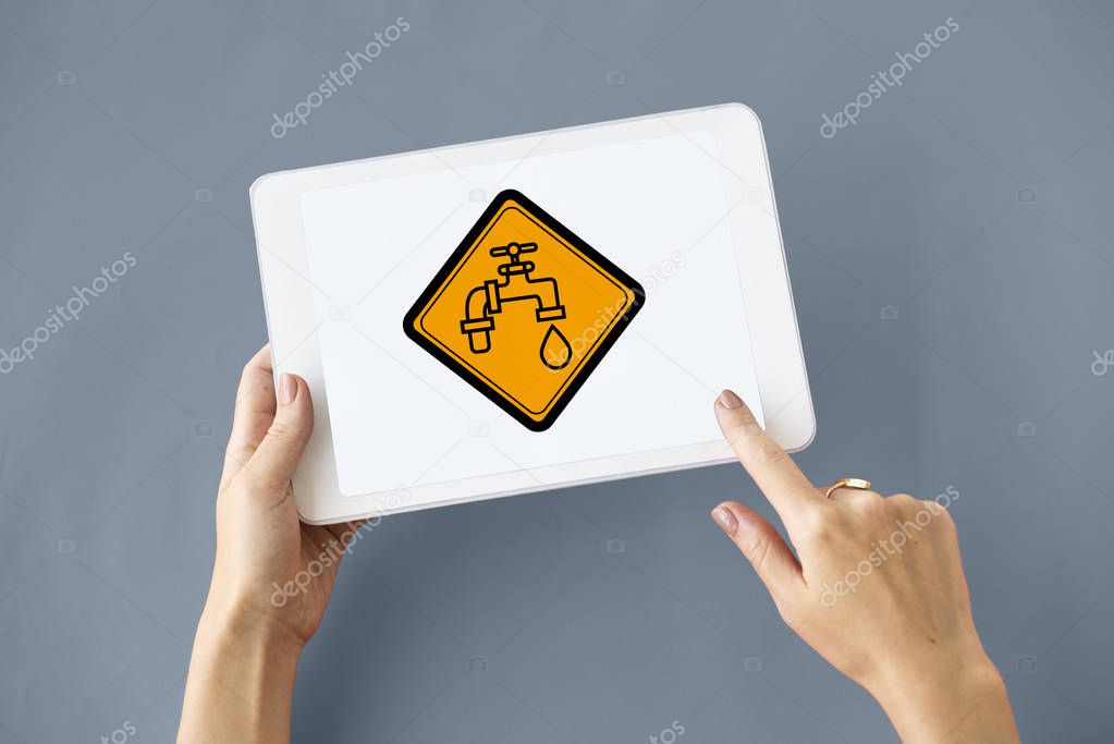 Human's hands holding digital tablet 