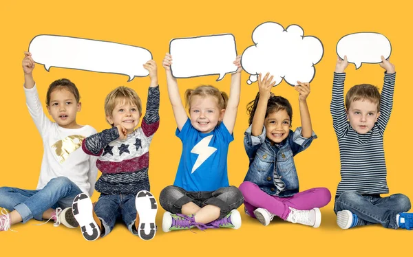 Children holding speech clouds — Stock Photo, Image