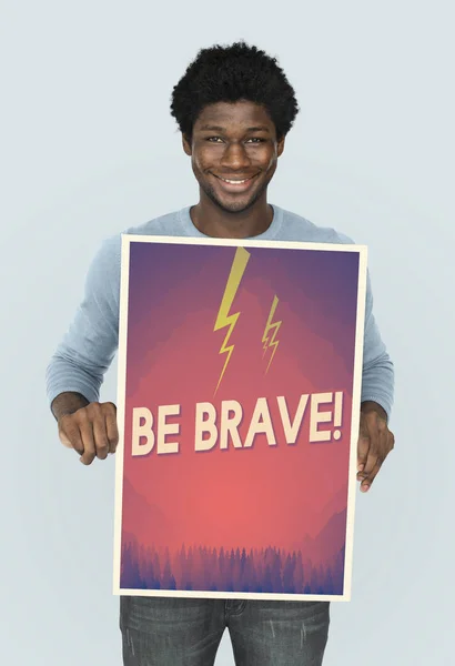 African man holding graphic banner — Stock Photo, Image