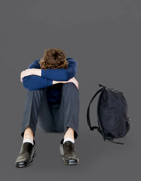 Stressato Studente seduto da solo — Foto Stock