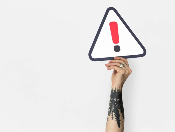 Person Holding Caution Sign — Stock Photo, Image