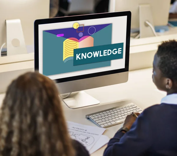 Boy and girl looking at monitor screen — Stock Photo, Image