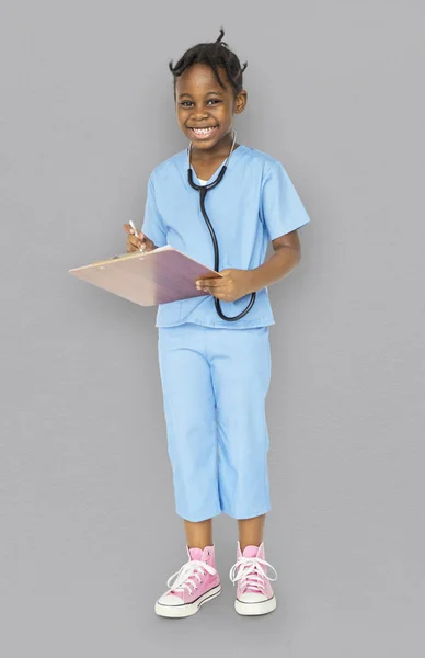 Meisje in uniform van de arts — Stockfoto
