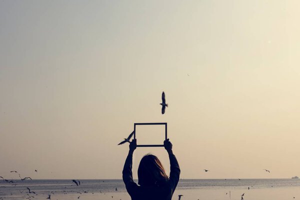 woman holding photo frame