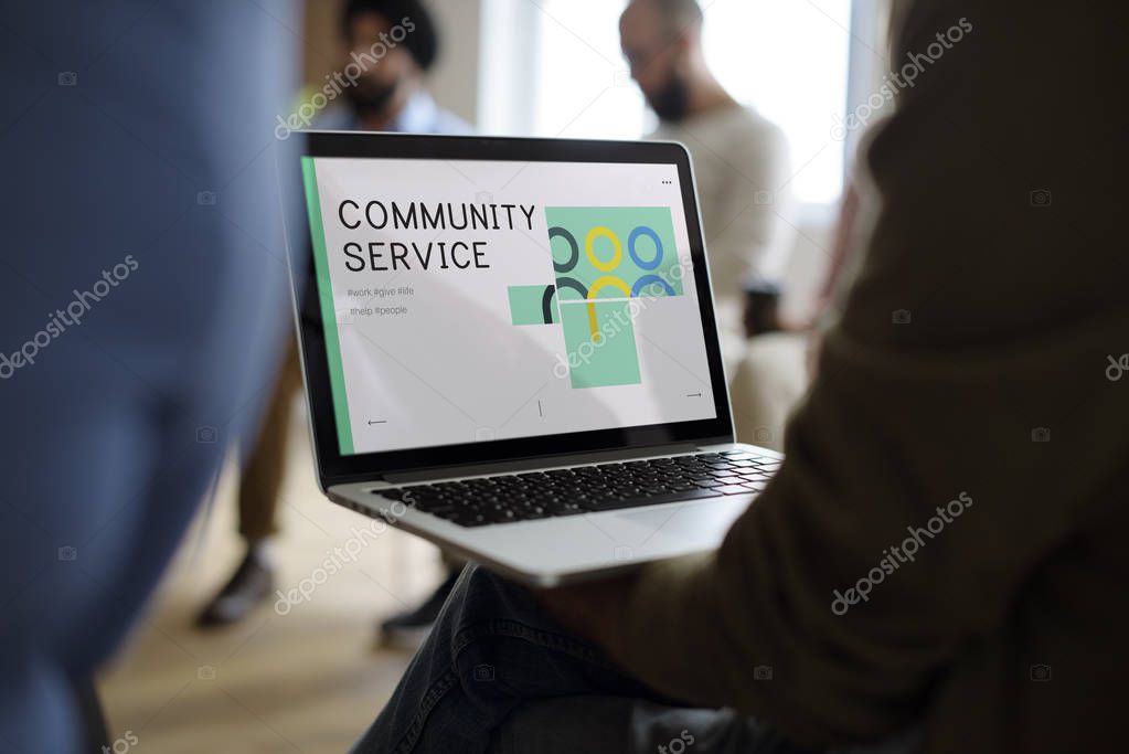 People on the Networking Seminar, person using laptop, monitor screen with title: Community Service