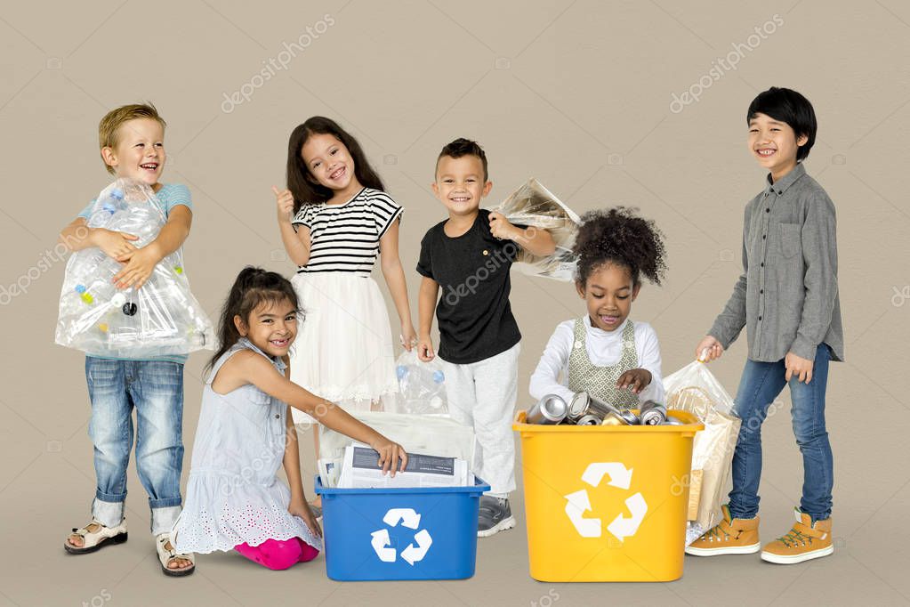 Group of adorable kids with waste for recycling