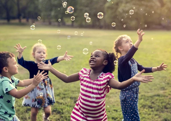 Children playing with soap bubbles — Stock Photo, Image