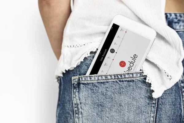 Smartphone in pocket of female jeans — Stock Photo, Image