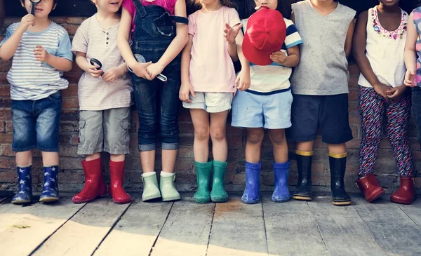 Niños con botas de goma —  Fotos de Stock