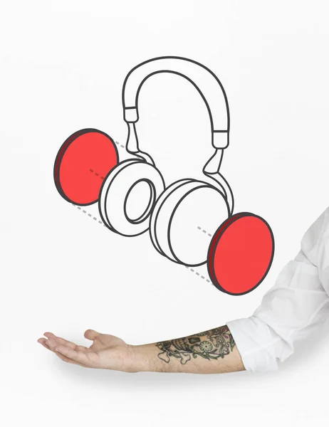 Hand zeigt auf Kopfhörer-Symbol — Stockfoto