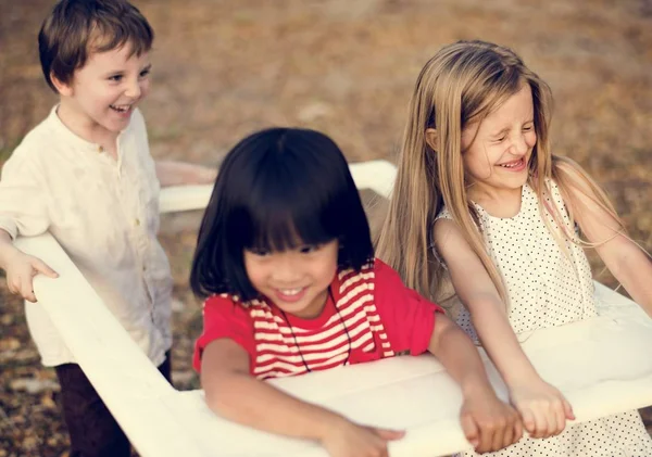 Children carrying photo frame — Stock Photo, Image