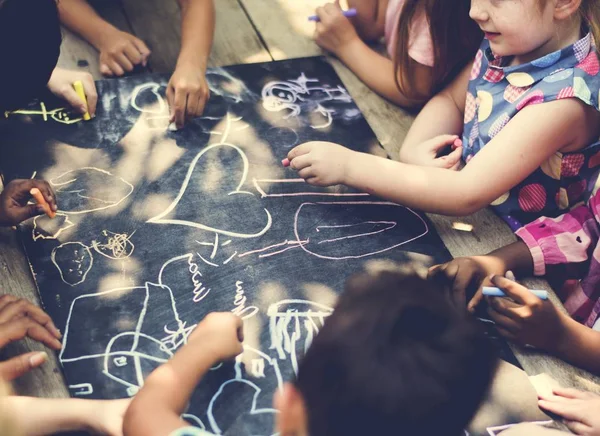 Kids Drawing on the Chalk Boar